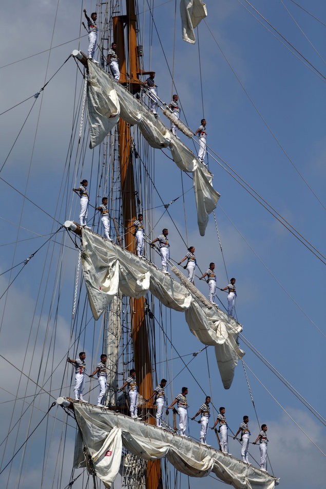 Sailors stand on the mast during the arrival of Mexico's naval training ship ARM Cuauhtemoc in Puerto Quetzal, Guatemala