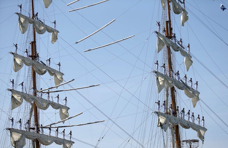 Sailors stand on the mast during the arrival of Mexico's naval training ship ARM Cuauhtemoc in Puerto Quetzal, Guatemala