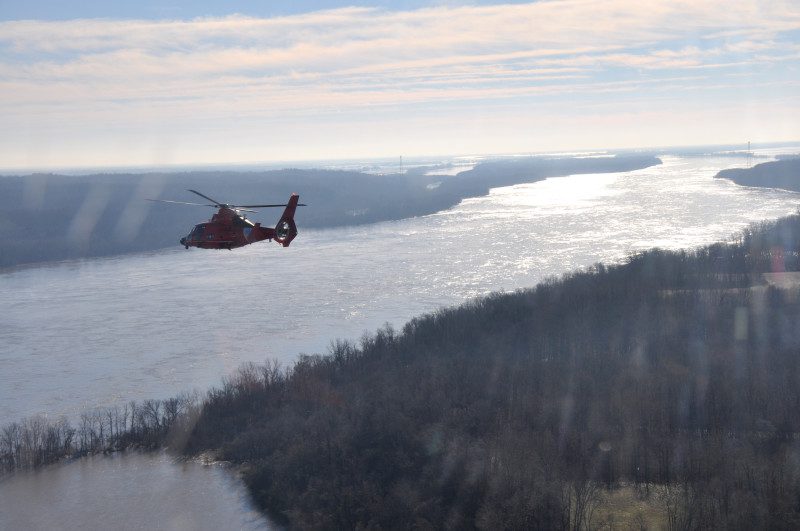 A Coast Guard MH-65 Dolphin helicopter crew surveys the region surrounding Cape Girardeau, Mo., as part a joint response to the Midwest Flooding, Jan. 3, 2016. Coast Guard aircrews were brought to Cape Girardeau to be used as search and rescue platforms and monitor high water and flooding in the region. (Photo courtesy of U.S. Coast Guard Aircrews)