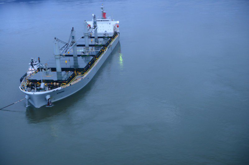 The motor vessel Sparna, a 623-foot Panamanian-flagged bulk carrier reportedly briefly ran aground while transiting the Columbia River near Cathlamet, Wash., March 21, 2016. The vessel is safely anchored, and is maintaining position, with the assistance of two tugs, as an approved salvage and repair plan is developed. (U.S. Coast Guard photo by Petty Officer 1st Class Levi Read)