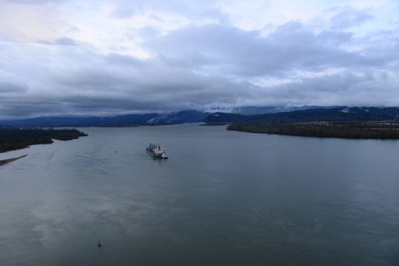 The motor vessel Sparna, a 623-foot Panamanian-flagged bulk carrier, sits damaged but afloat in the Columbia River near Cathlamet, Wash., March 21, 2016. The Sparna reportedly briefly ran aground while transiting the Columbia River and took on water in void spaces, and is currently safely anchored and awaiting repairs. (U.S. Coast Guard photo by Petty Officer 1st Class Levi Read)
