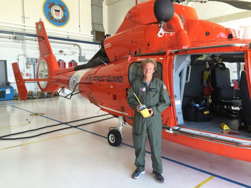 Olivier Jehl, a French sailor, shows off his EPIRB at Coast Guard Air Station Atlantic City, N.J., Monday, May 16, 2016, after he was rescued by the Coast Guard. Jehl was attempting a solo voyage from New York to the United Kingdom when his 21-foot sailboat struck a submerged object and sank, causing him to use his rescue raft, emergency position-indicating radio beacon and flares. (U.S. Coast Guard photo by Chief Petty Officer Nick Ameen)