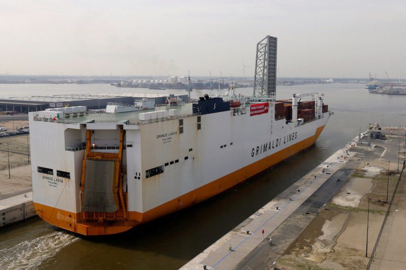 A cargo ship crosses the world's biggest lock "Kieldrechtsluis" during its inauguaration at Belgium's port of Antwerp, June 10, 2016. Picture taken through a window. REUTERS/Francois Lenoir