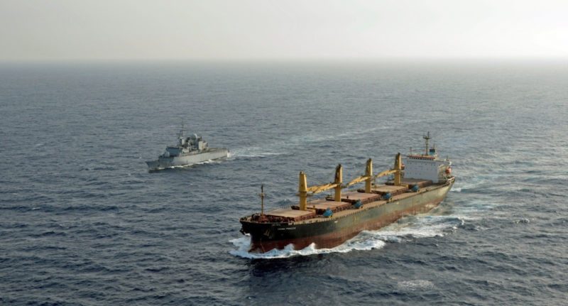 An EU Naval Force warship escorts a World Food Programme (WFP) chartered vessel in the Gulf of Aden. Photo: EU Navfor
