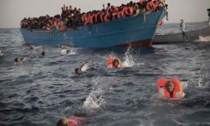 Libya Migrants Swimming From Overcrowded Boat