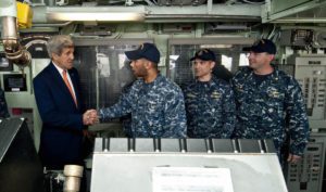 John Kerry on the bridge of a US Navy Ship