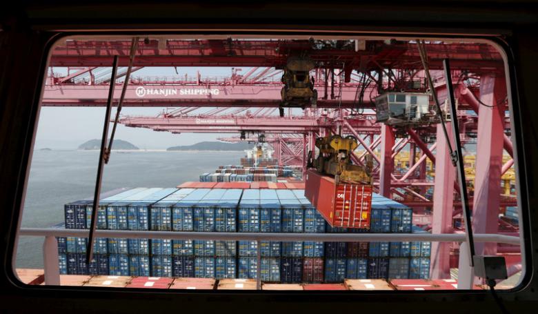 File photo of a crane carrying a container from a ship of Hanjin Shipping at Hanjin container terminal at the Busan New Port in Busan