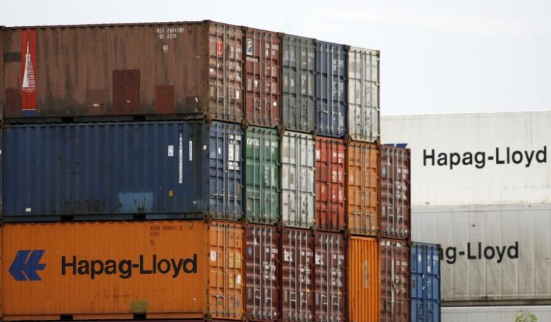 Shipping containers belonging to German transportation firm Hapag-Lloyd are seen stacked at a port in Singapore