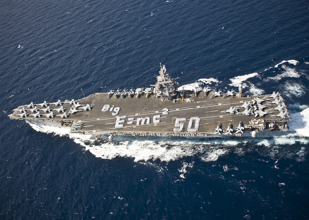 Sailors spell out "E=MC2" on the flight deck of the aircraft carrier USS Enterprise (CVN 65) to commemorate the 50th anniversary of the ship's commissioning, Feb. 17, 2011. U.S. Navy Photo