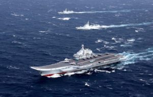 FILE PHOTO: China's Liaoning aircraft carrier with accompanying fleet conducts a drill in an area of South China Sea