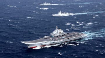 FILE PHOTO: China's Liaoning aircraft carrier with accompanying fleet conducts a drill in an area of South China Sea