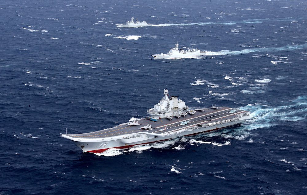 FILE PHOTO: China's Liaoning aircraft carrier with accompanying fleet conducts a drill in an area of South China Sea