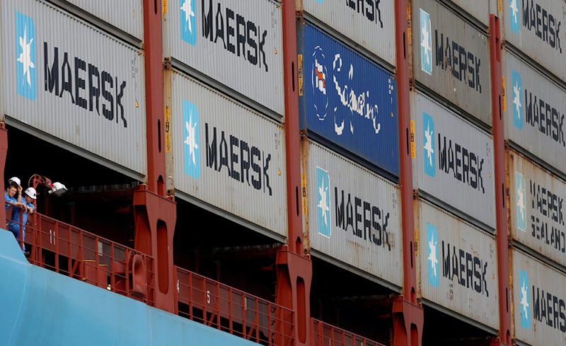 FILE PHOTO: Crew members look out from the MV Maersk Mc-Kinney Moller as it berths at a PSA International port terminal in Singapore, September 27, 2013. REUTERS/Edgar Su/File Photo GLOBAL BUSINESS WEEK AHEAD PACKAGE Ð SEARCH BUSINESS WEEK AHEAD MARCH 13 FOR ALL IMAGES