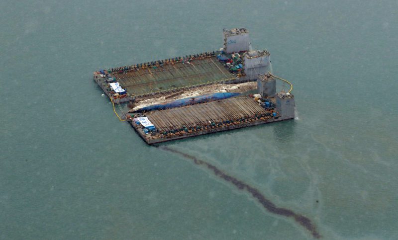 Oil leaked from the sunken ferry Sewol is seen during its salvage operations at the sea off Jindo, South Korea, March 23, 2017. Yonhap via REUTERS