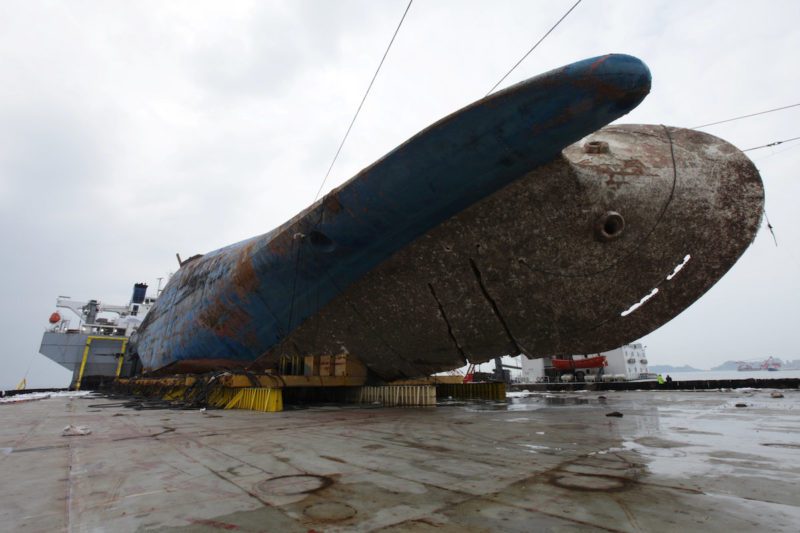 The sunken ferry Sewol sits on a semi-submersible ship during its salvage operations at the sea off Jindo, South Korea, in this handout picture provided by the Ministry of Oceans and Fisheries and released by Yonhap on March 26, 2017. The Ministry of Oceans and Fisheries/Yonhap via REUTERS ATTENTION EDITORS - THIS IMAGE HAS BEEN SUPPLIED BY A THIRD PARTY. SOUTH KOREA OUT. FOR EDITORIAL USE ONLY. NO RESALES. NO ARCHIVE.