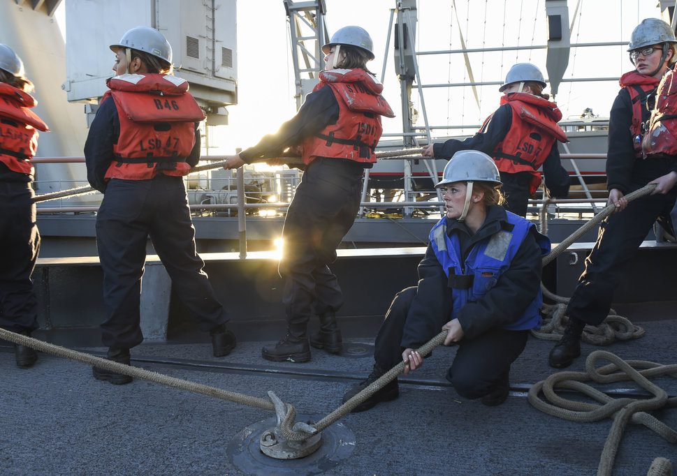 Female Sailor Handling Lines Aboard Ship