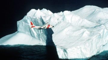INTERNATIONAL ICE PATROL Flying Over Iceberg