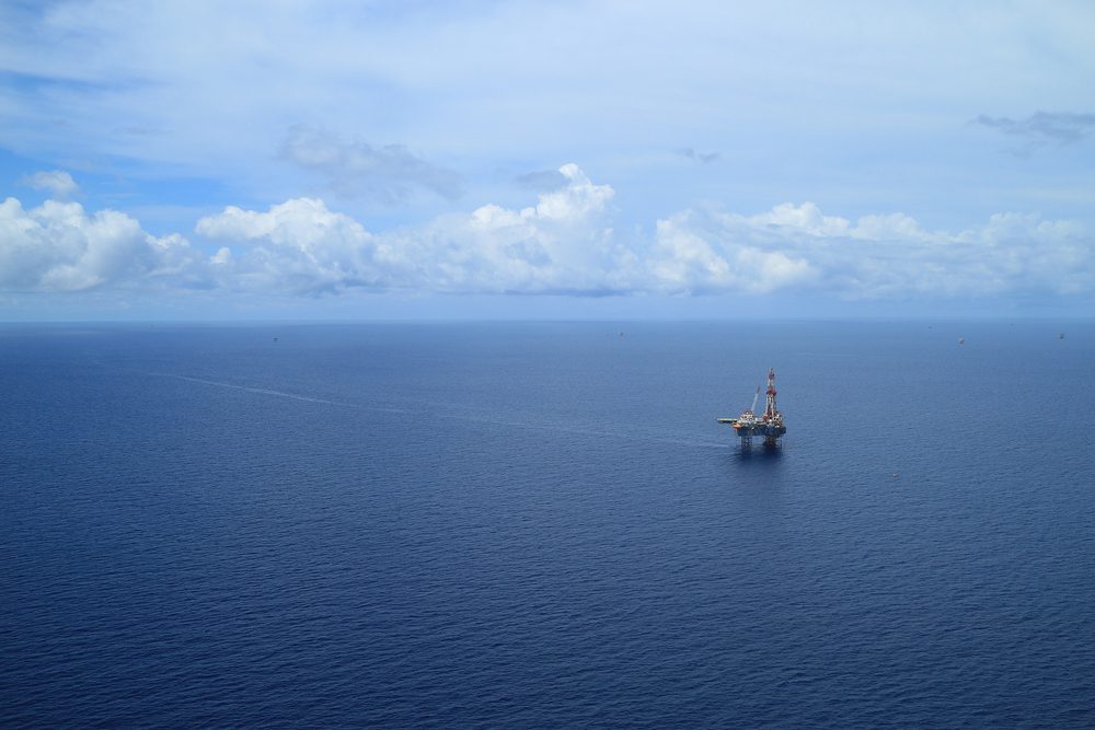 Offshore drilling rig photo via Shutterstock / James Jones Jr
