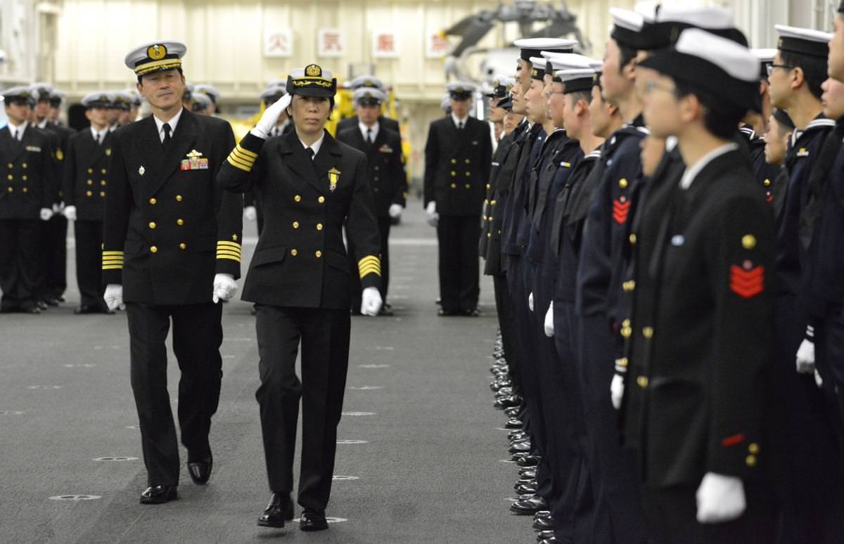 Newly-appointed Commander of First Escort Division of JMSDF Ryoko Azuma salutes to soldiers in Yokohama