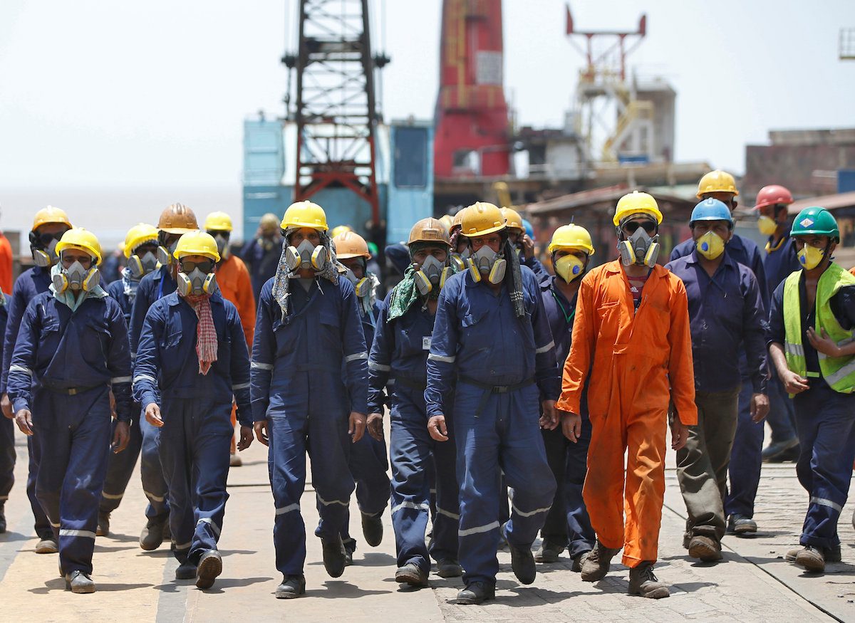 workers-wearing-protective-gear-arrive-to-dismantle-a-decommissioned