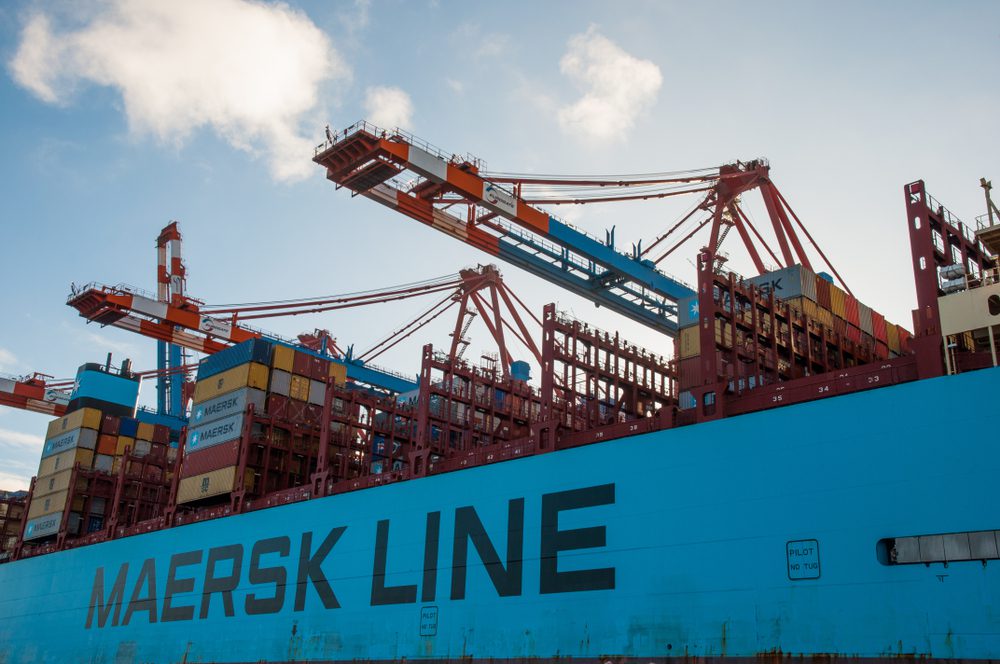 An up-close image of a Maersk ship in port