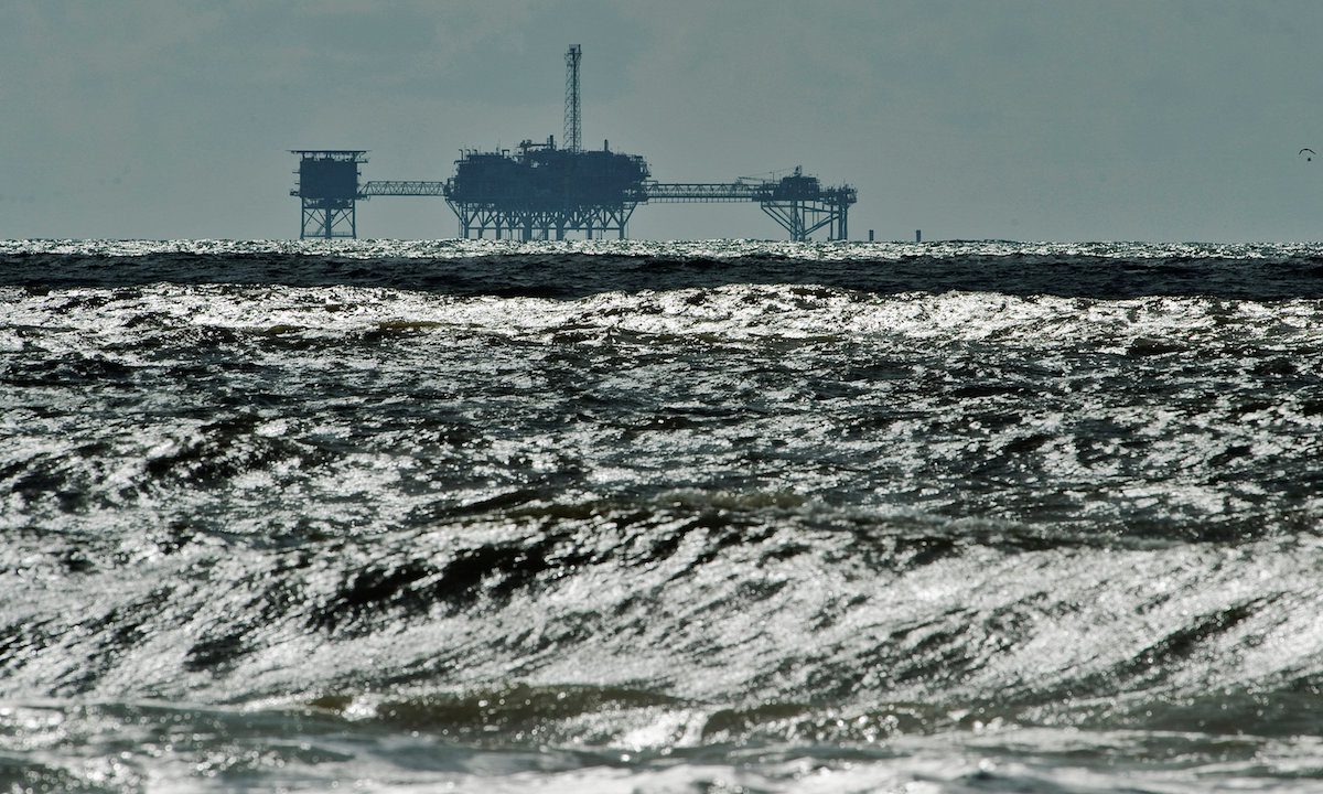 FILE PHOTO: An oil and gas drilling platform stands offshore in the Gulf of Mexico in Dauphin Island, Alabama, U.S., October 5, 2013. REUTERS/Steve Nesius/File Photo