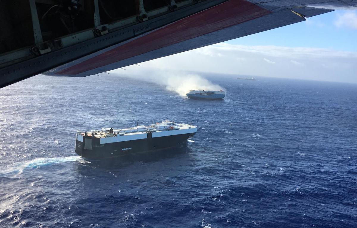 US Coast Guard Hercules flies over Burning Ship