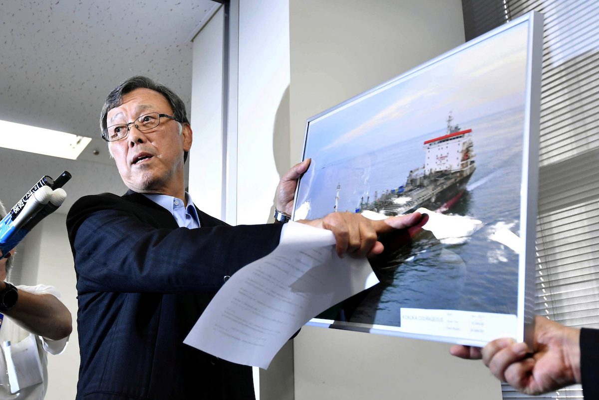 Yutaka Katada, president of shipping company Kokuka Sangyo Ltd. points to a picture of their tanker Kokuka Courageous, one of two that were hit in suspected attacks in the Gulf of Oman, during a news conference in Tokyo