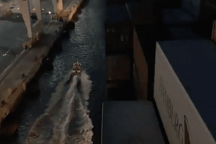 Watch: Crazy Dude Brings Boat Between Ship and Pier During Docking