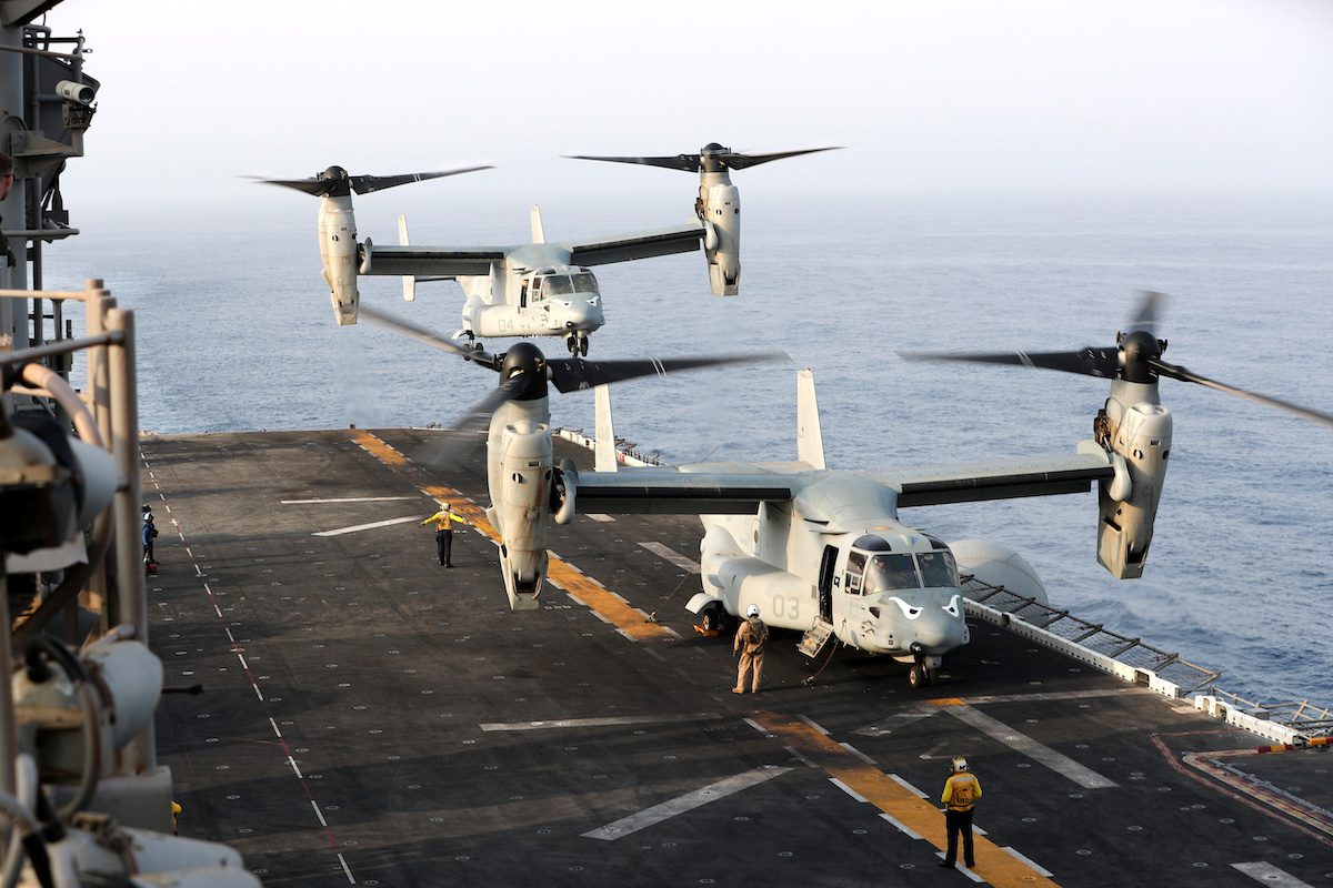 An MV-22 Osprey aircraft lands on the deck of the USS Boxer (LHD-4) in the Arabian Sea off Oman