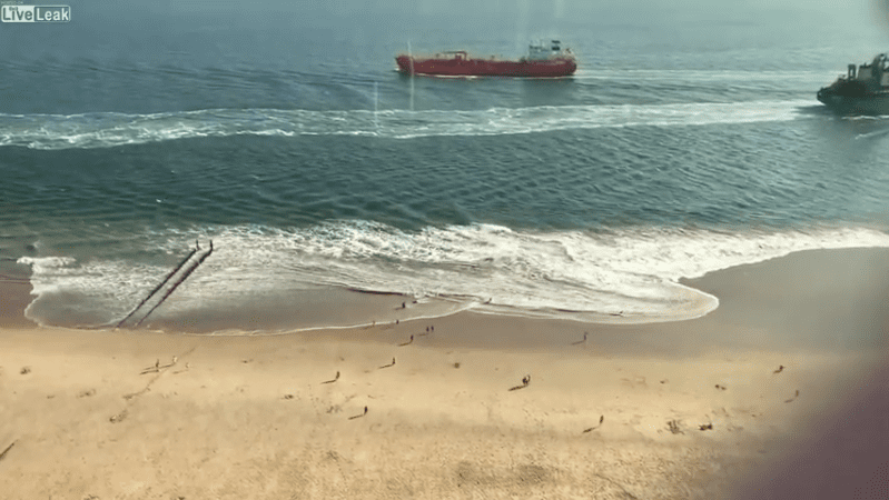 Watch: Ship's Wake Sends Beachgoers Scrambling
