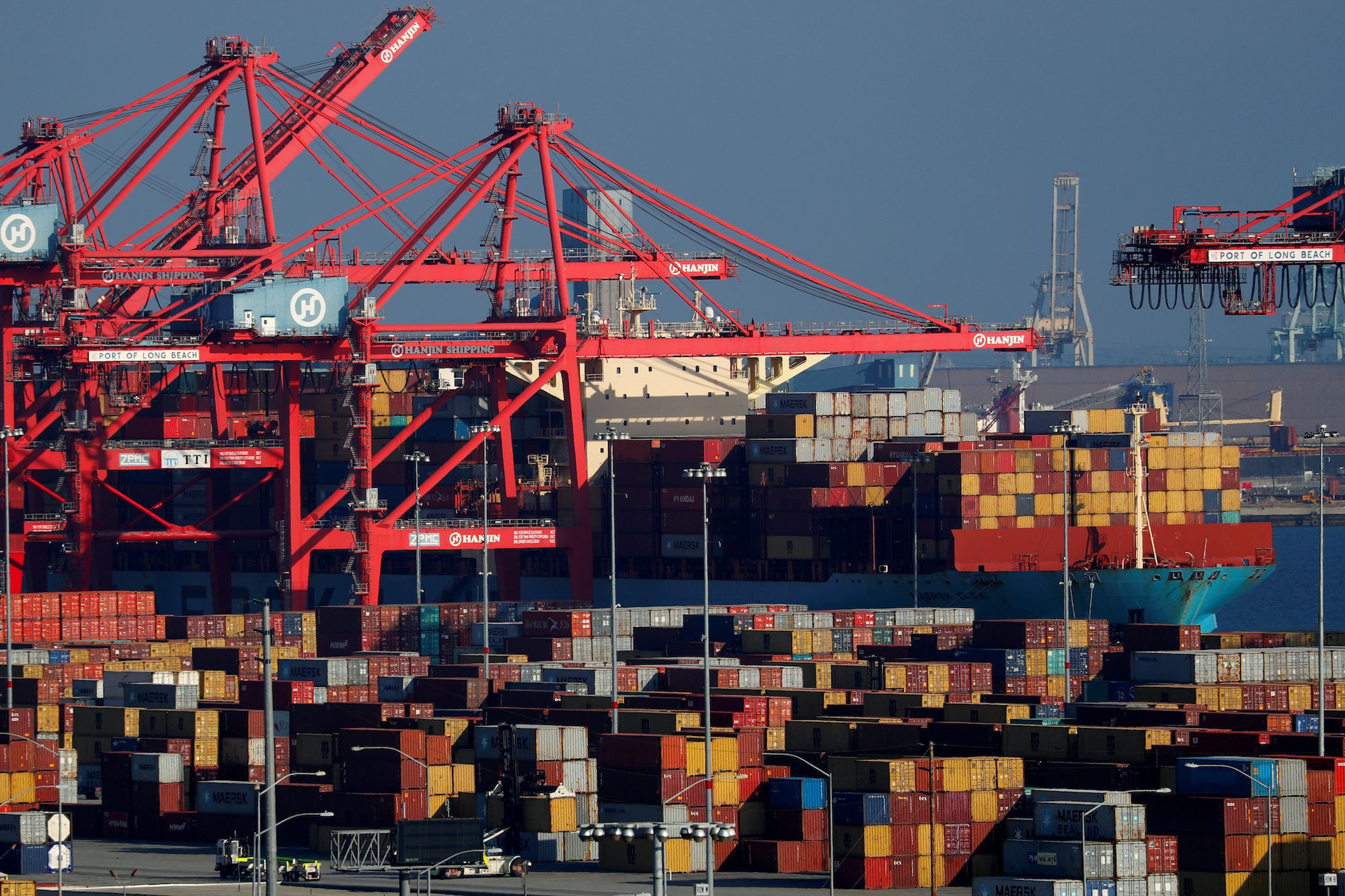FILE PHOTO: Ships and shipping containers are pictured at the port of Long Beach in Long Beach, California, U.S., January 30, 2019. REUTERS/Mike Blake/File Photo