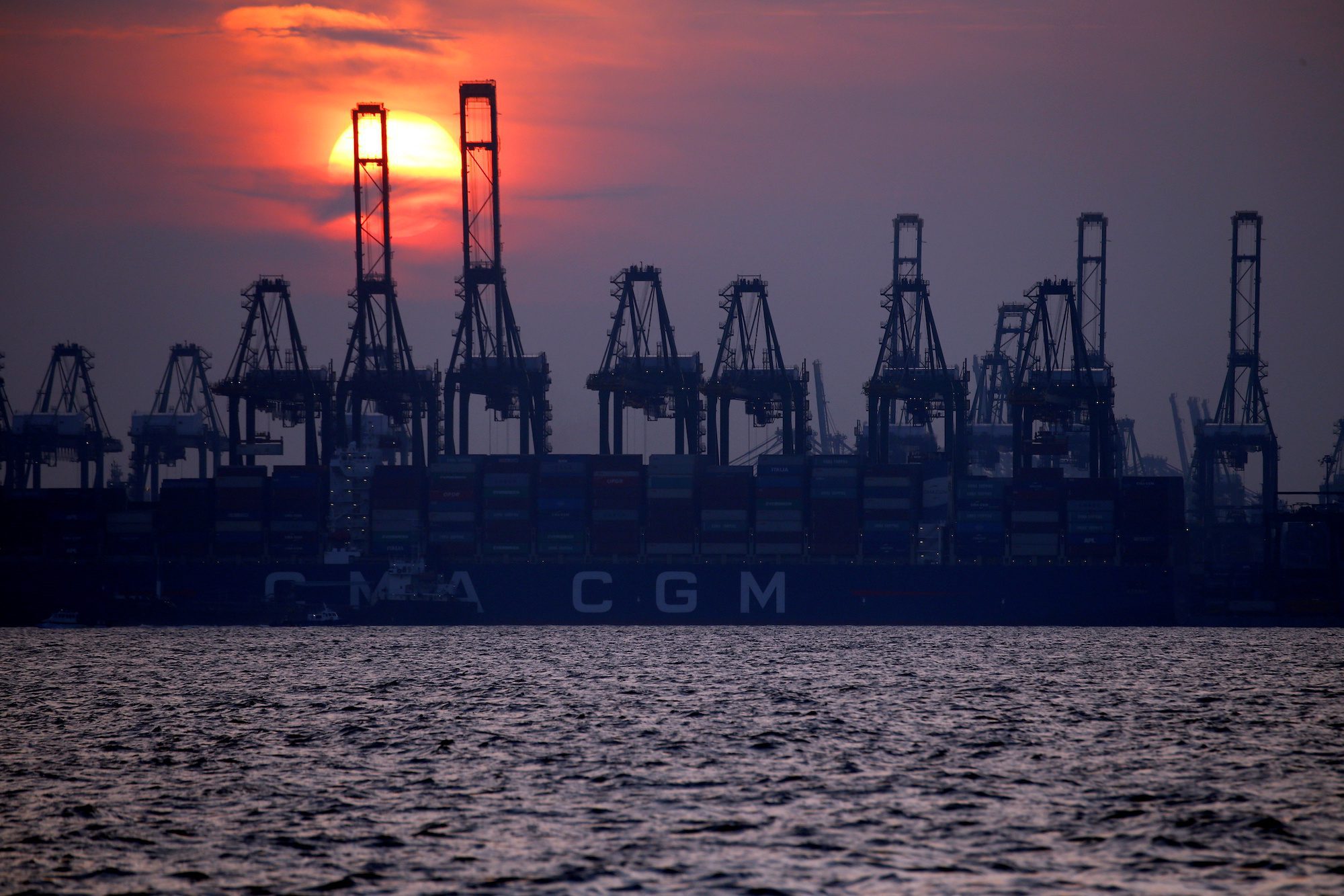 FILE PHOTO: Container cranes are pictured at the port of Singapore, June 10, 2018. REUTERS/Feline Lim/File Photo
