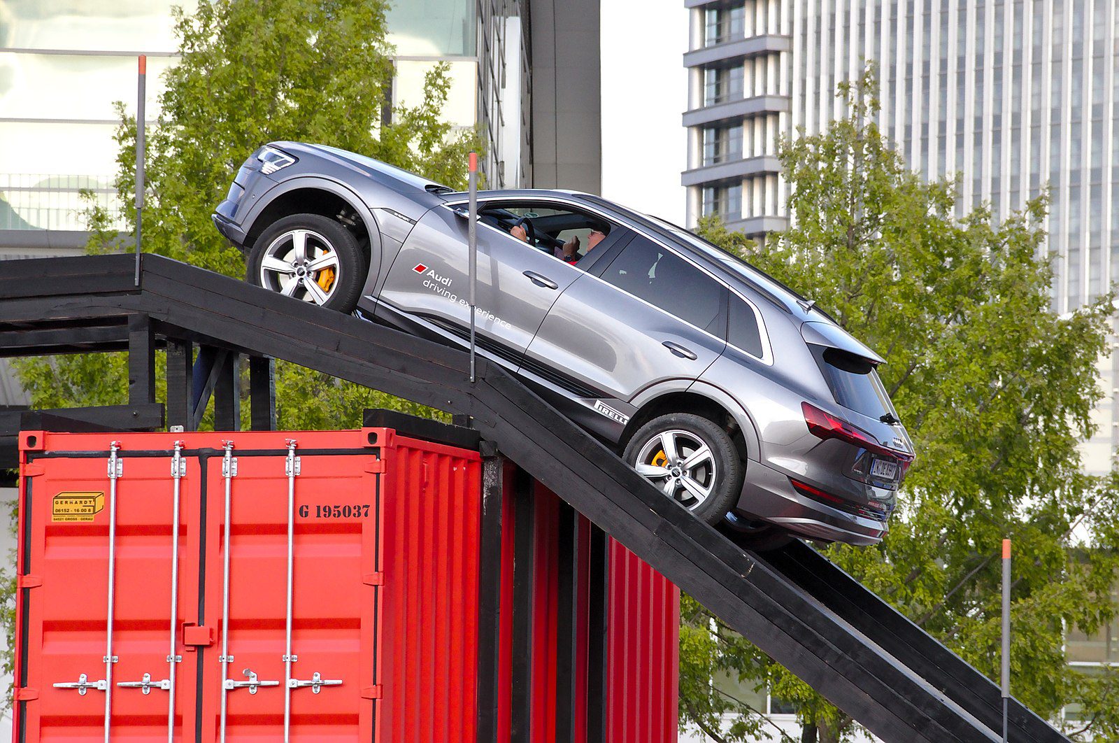Car being loaded on shipping containers