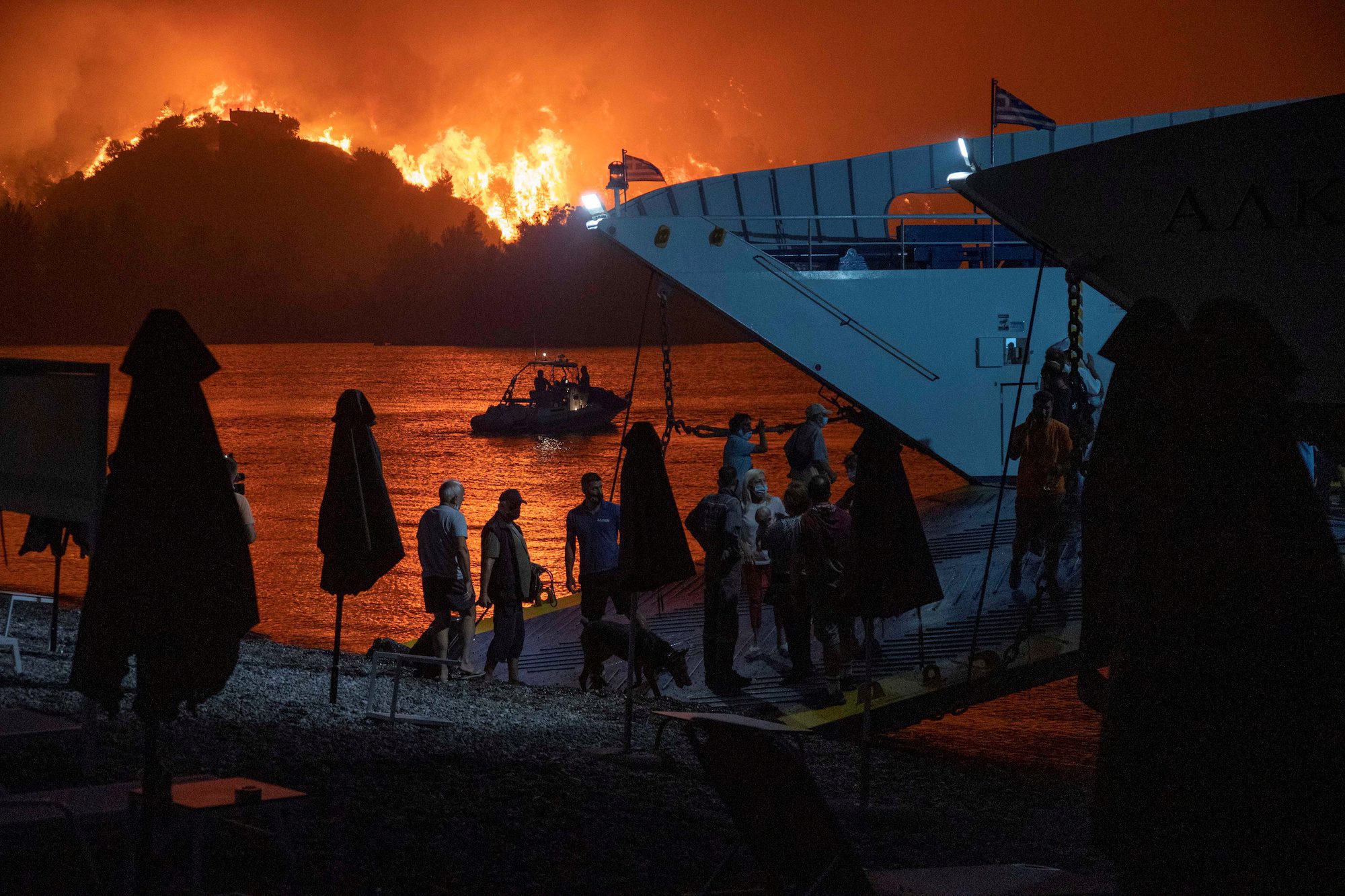 Harrowing Video Shows Residents Fleeing Burning Greek Island by Ferry