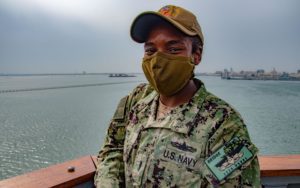 Officer On A US Navy Ship's Bridge Wing