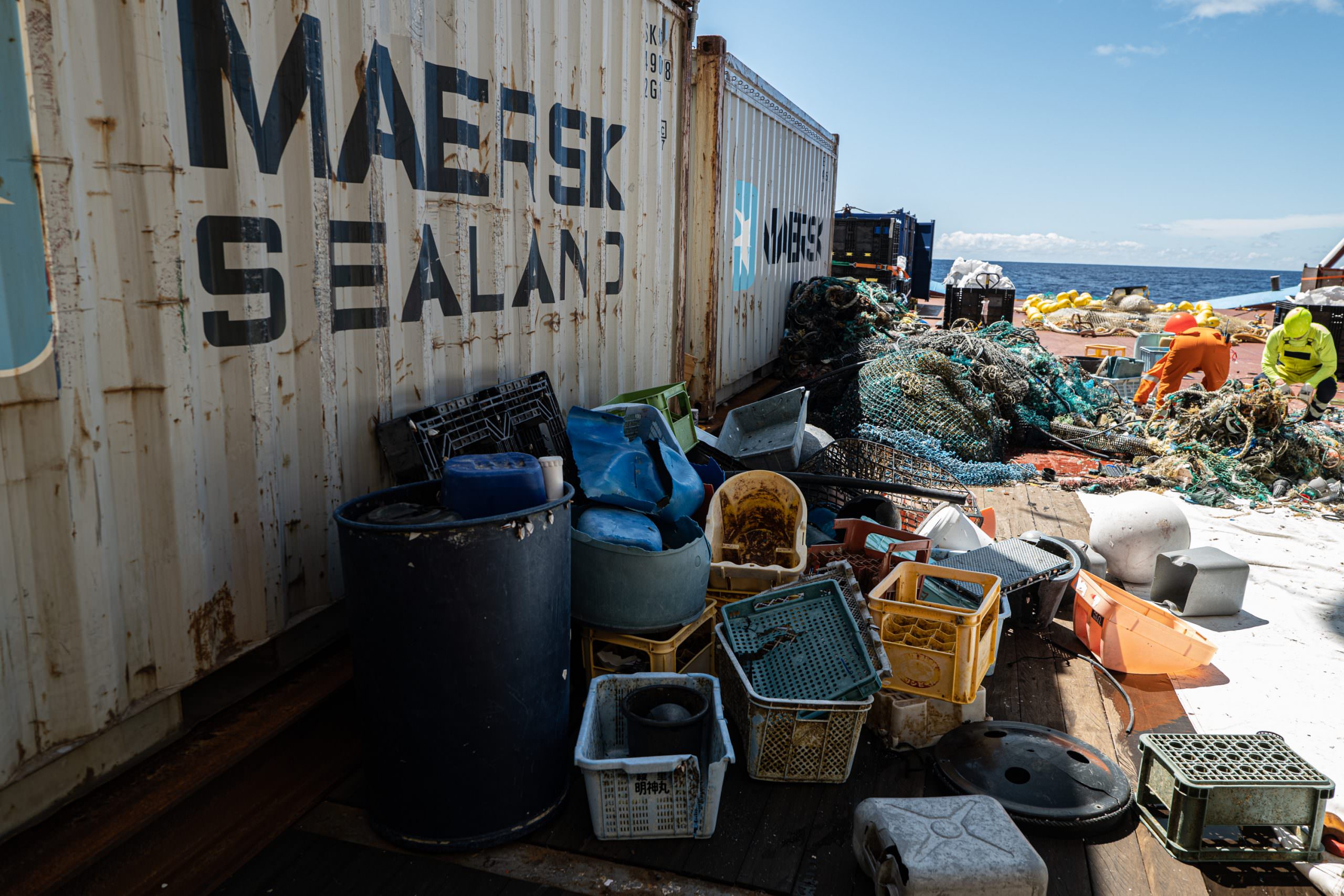 Maersk Container Next To Ocean Trash