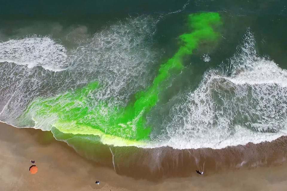 This image shows a rip current using a harmless green dye.