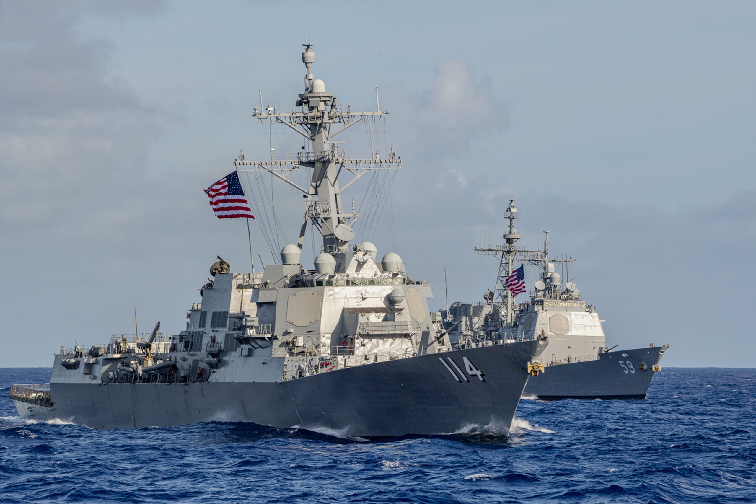 The Arleigh Burke-class guided-missile destroyer USS Ralph Johnson (DDG 114) and the Ticonderoga-class guided-missile cruiser USS Princeton (CG 59). U.S. Navy File Photo