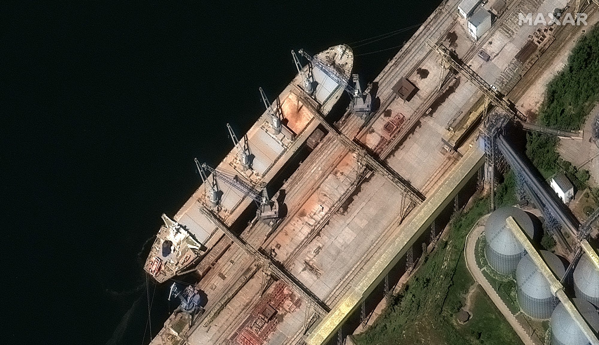 A satellite image shows a closeup of bulk carrier ship loading grain at the port of Sevastopol, Crimea May 19, 2022