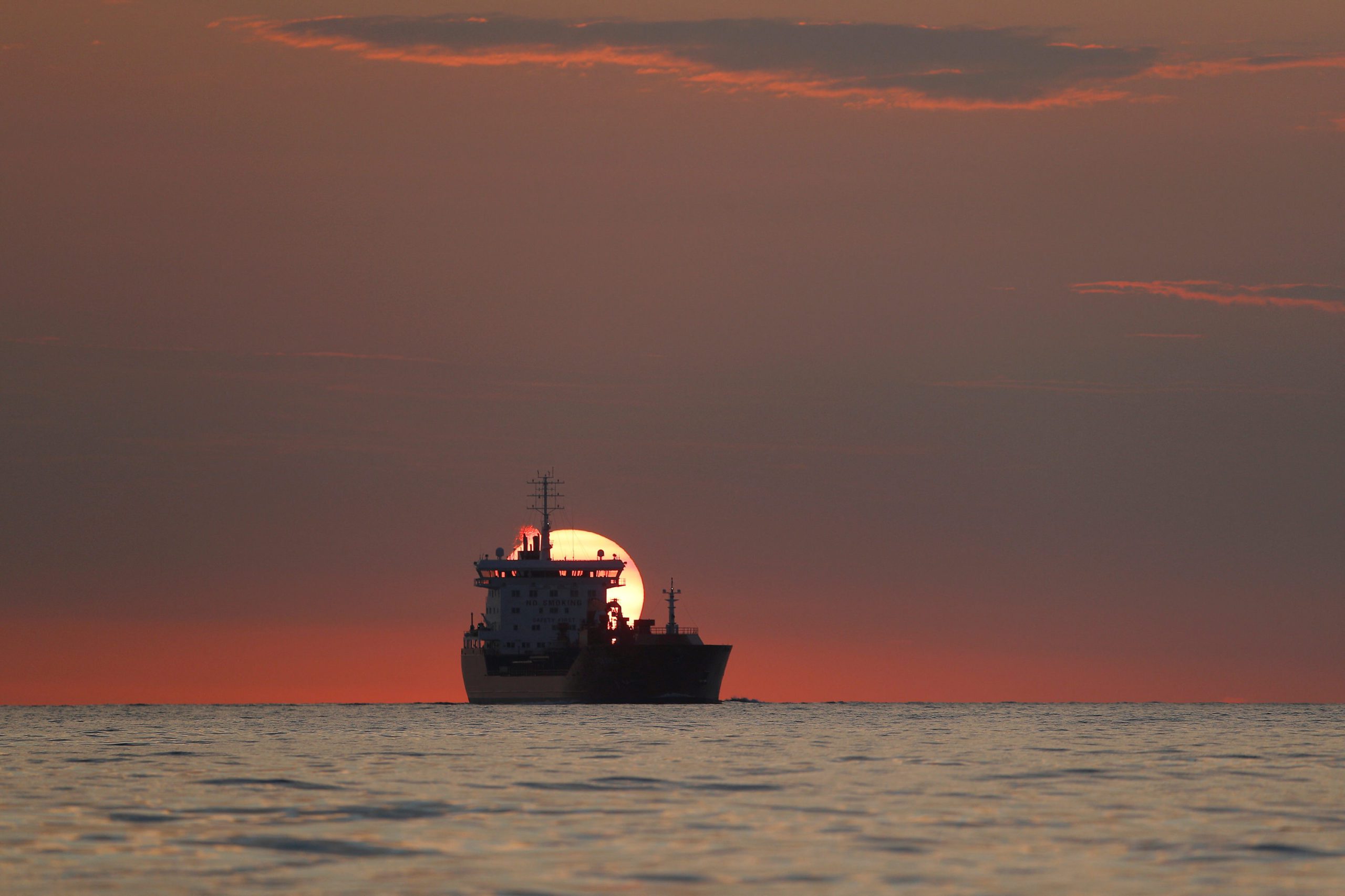 A tanker ship is seen in the English Channel at sunrise, near Dover, Britain, August 4, 2021. REUTERS/Peter Nicholls/File Photo