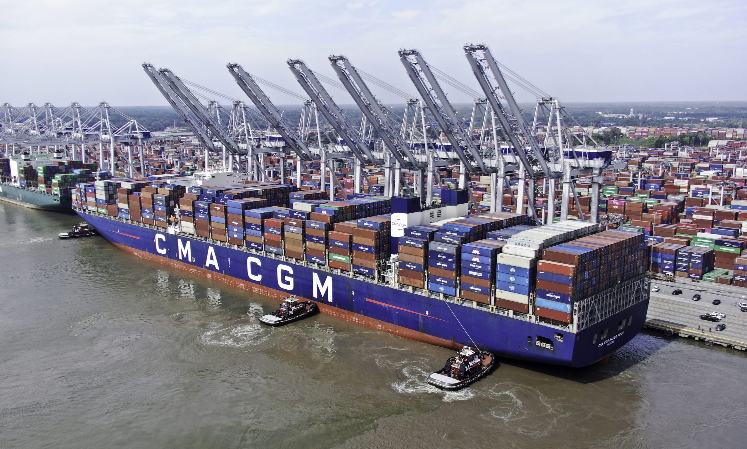 Tugs assist a CMA CGM containership to its berth at the Port of Savannah