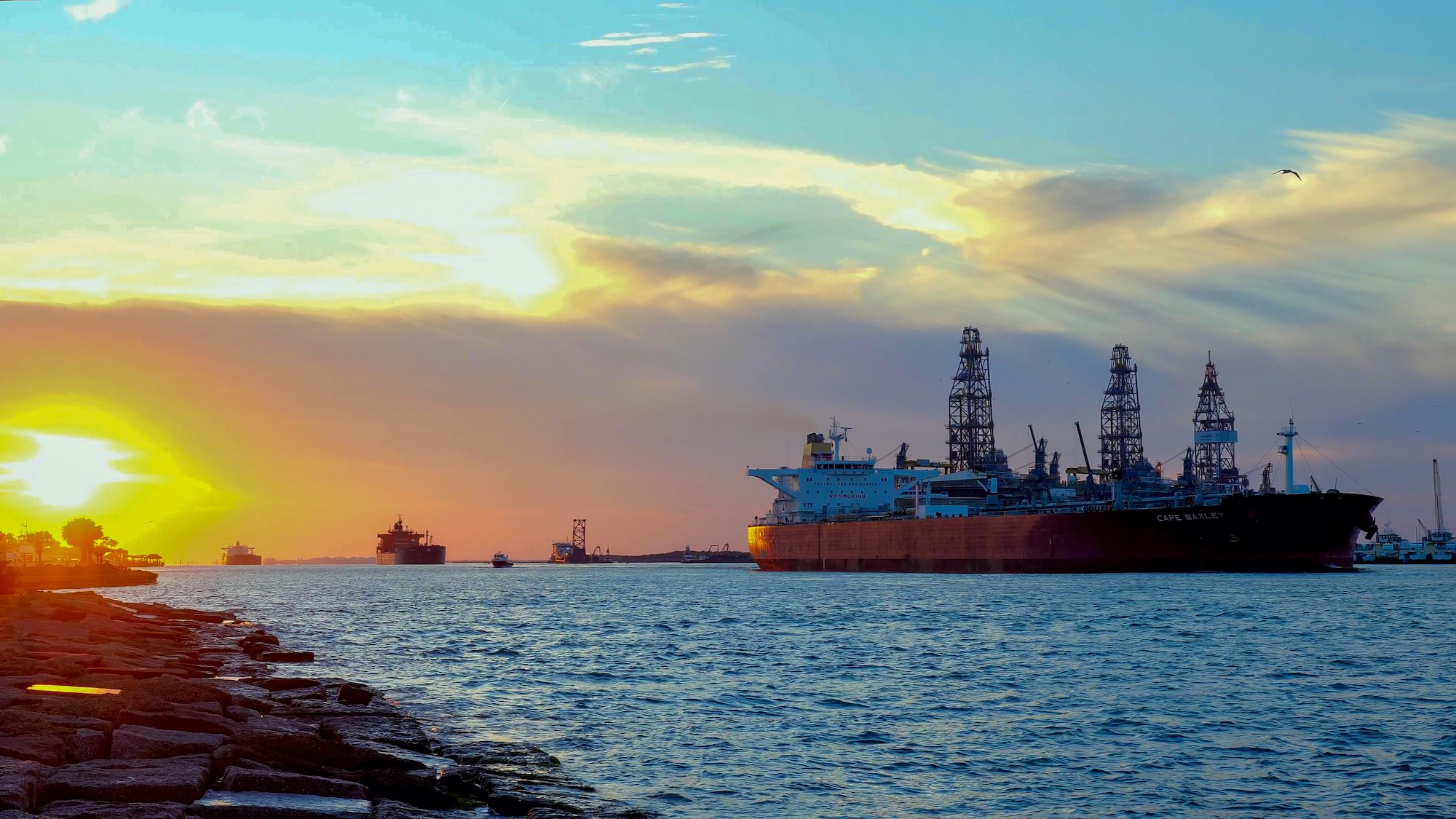 Oil tankers transiting the Corpus Christi ship channel to the Gulf of Mexico during sunset