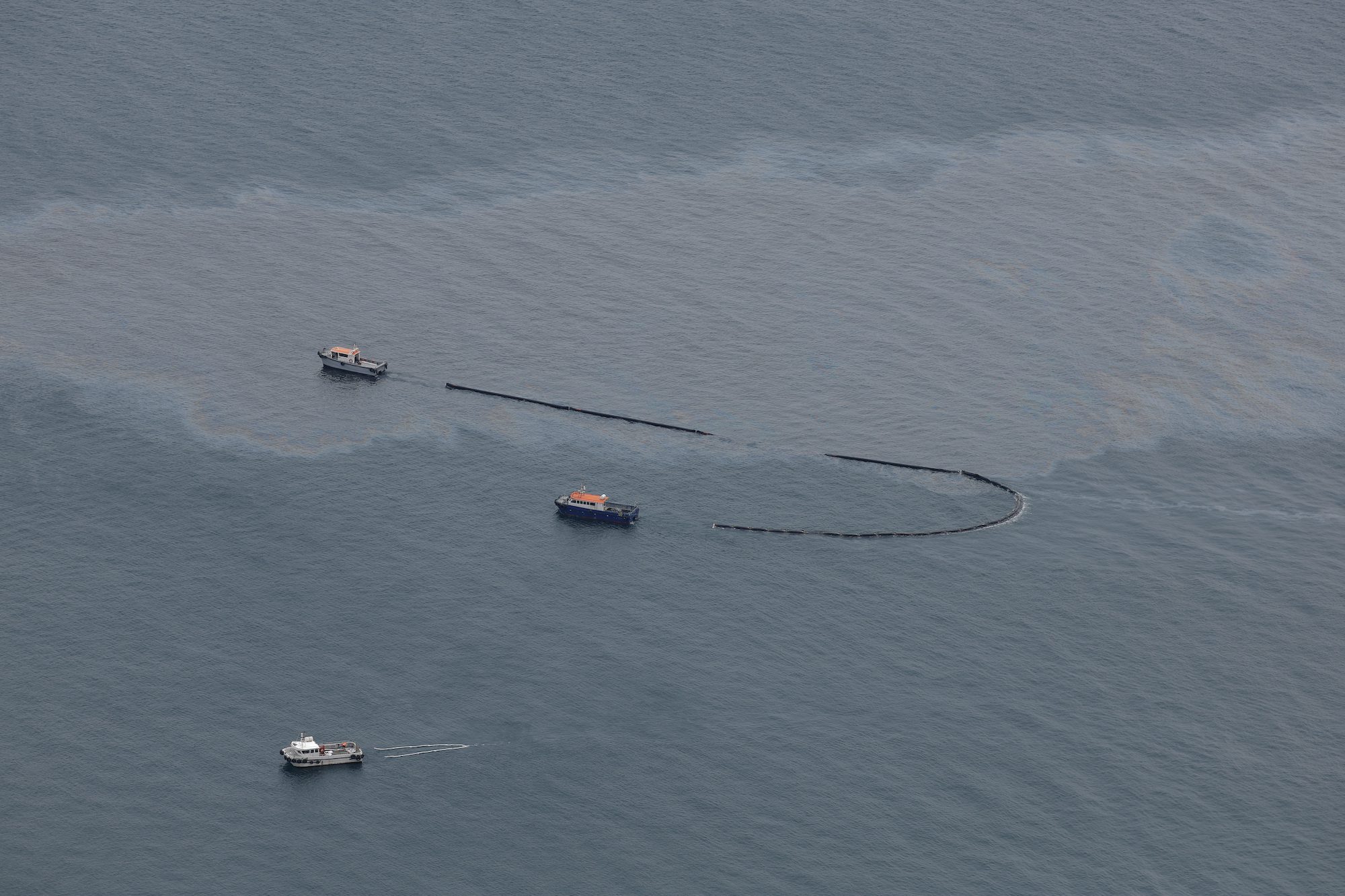 Oil leaking from bulk carrier off Gibraltar after tanker collision. REUTERS/Jon Nazca
