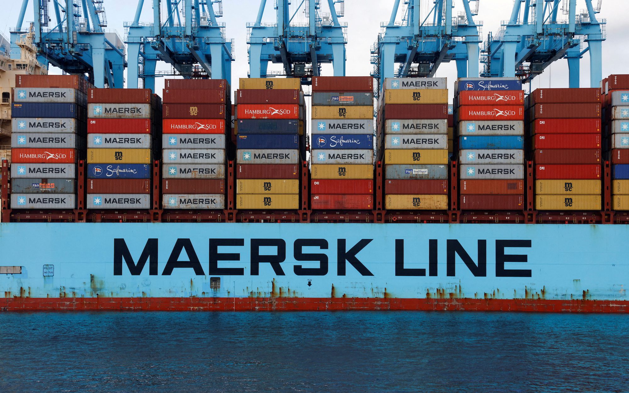 FILE PHOTO: Containers are seen on the Maersk's Triple-E giant container ship Majestic Maersk, one of the world's largest container ships, next to cranes at the APM Terminals in the port of Algeciras, Spain January 20, 2023. REUTERS/Jon Nazca/File Photo