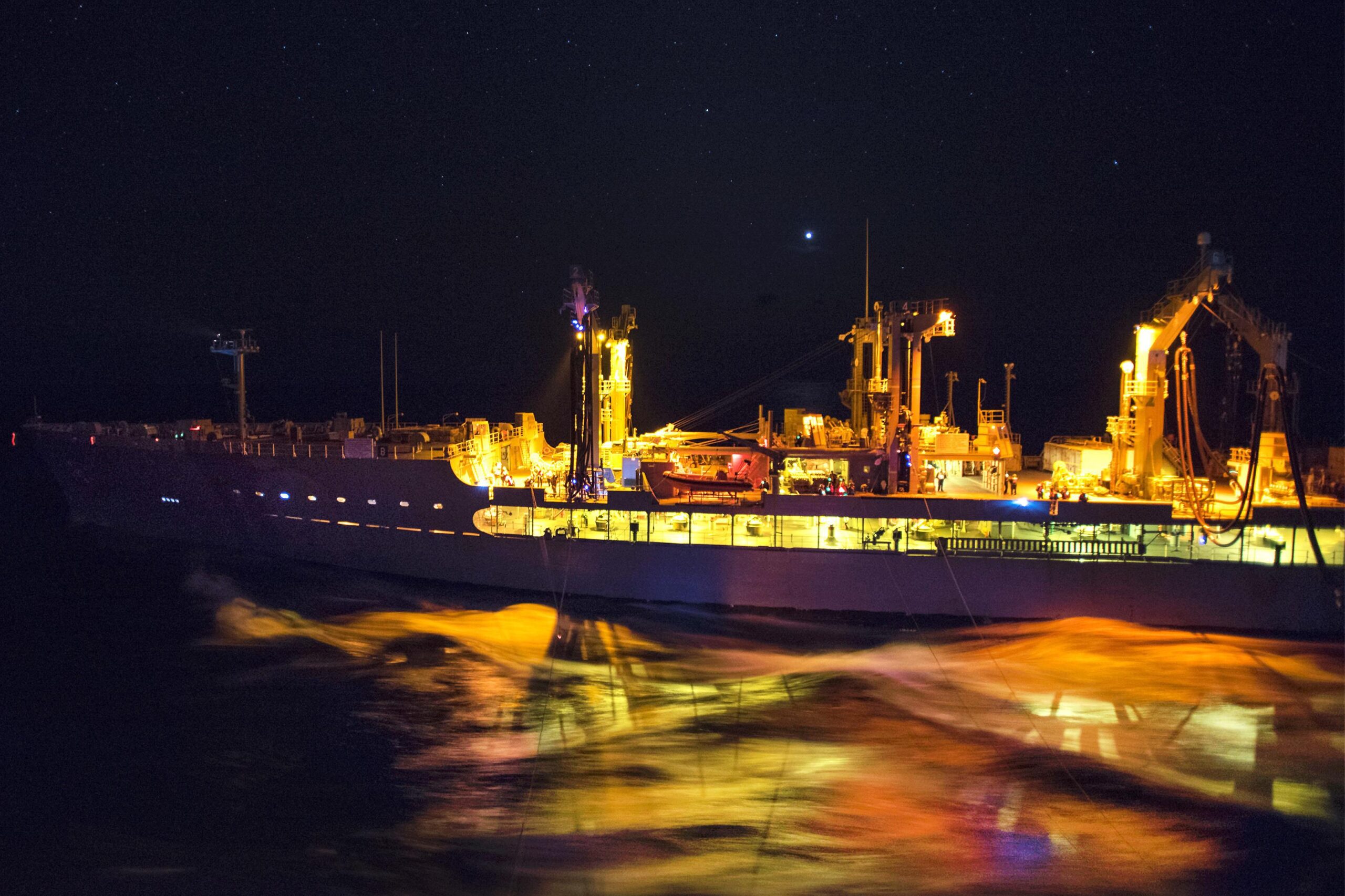 Navy oiler tanker at night