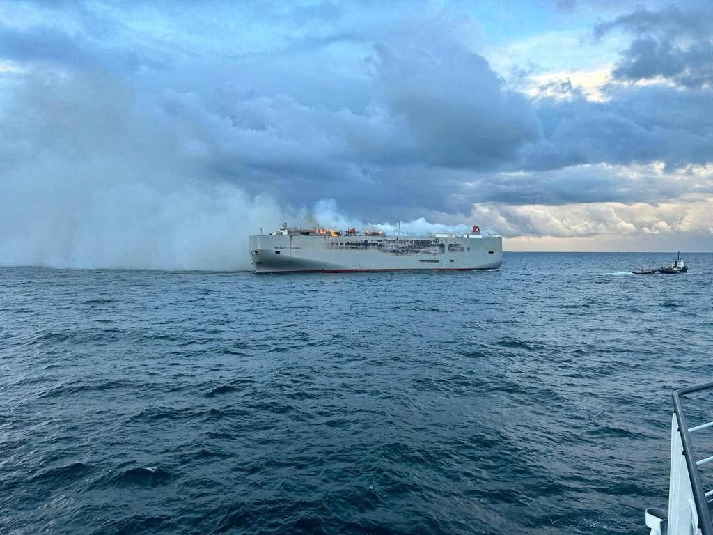 Smoke rises as a fire broke out on the cargo ship Fremantle Highway, at sea on July 26, 2023. Coastguard Netherlands Photo