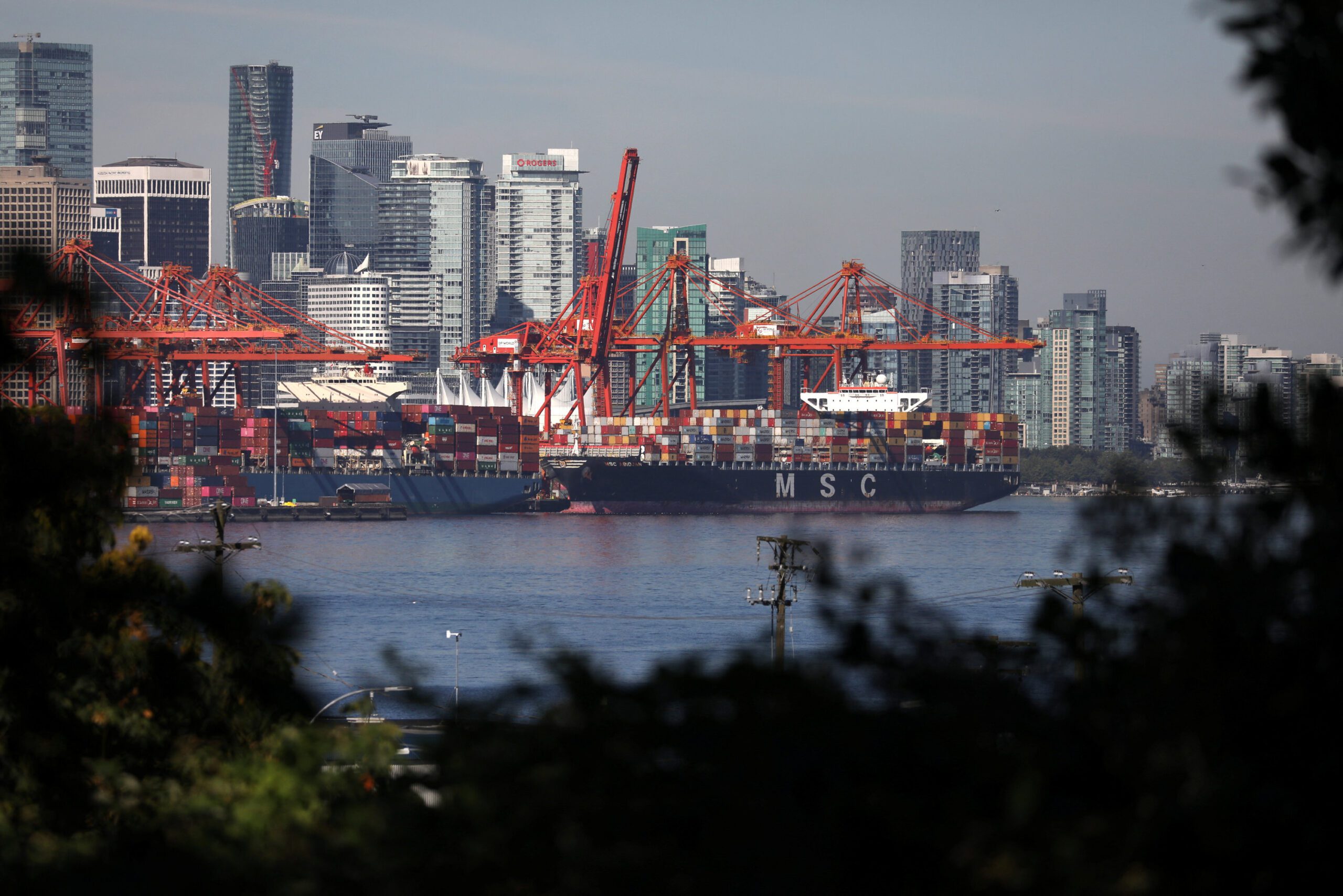 Container ships berth at the Port of Vancouver after Pacific coast dock workers with the International Longshore and Warehouse Union (ILWU) returned to clear the backlog of a 13-day strike in Vancouver, British Columbia, Canada