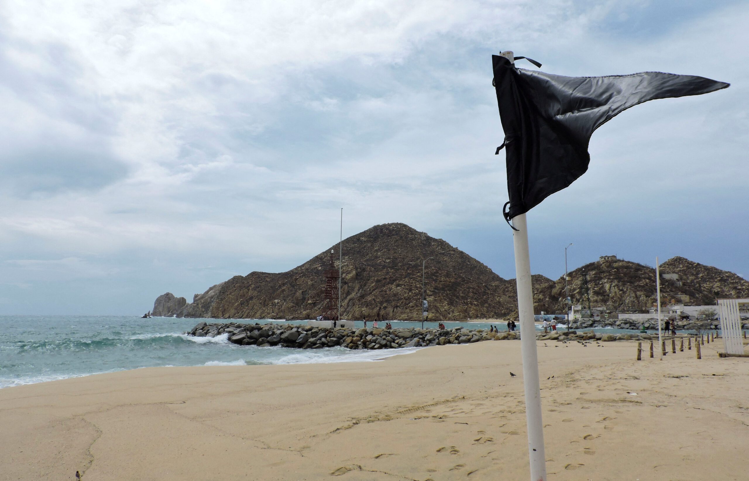 A black flag, placed to alert tourists of high waves and riptides which are unsafe for swimming, is pictured at a beach as a security measure by local authorities while the Category 4 Hurricane Hilary rushes toward Mexico's Baja California peninsula, in Cabo San Lucas, Mexico August 18, 2023. Photo via REUTERS/Monserrat Zavala