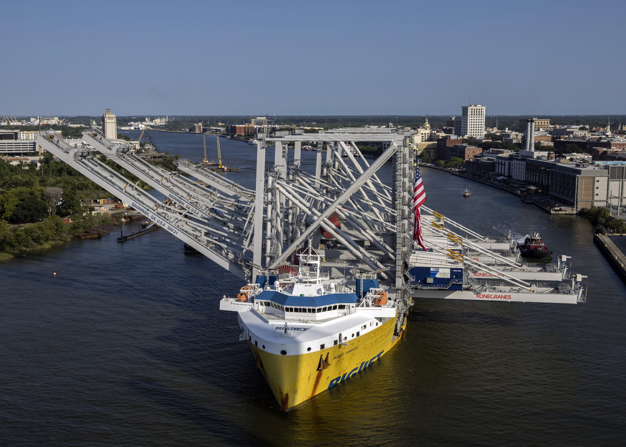 The Port of Savannah’s latest order of ship-to-shore cranes transits the Savannah River channel aboard the BigLift Barentsz on Thursday, Aug. 24, 2023, in Savannah, Ga. Credit: GPB Photo/Stephen B. Morton